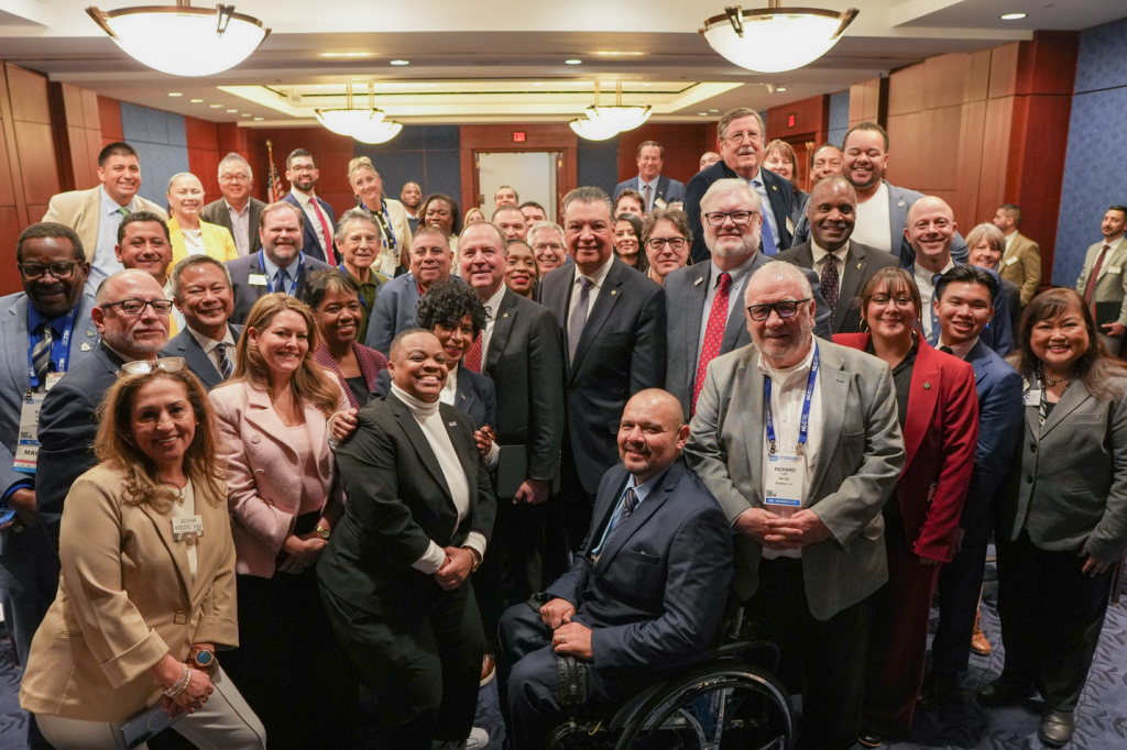 Group shot of Cal Cities members with Senators Alex Padilla and Adam Schiff